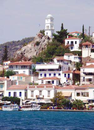 The famous clock tower above the town of Poros and home of Greek Sails