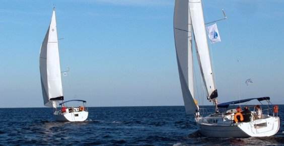 A Greek Sails Jeanneau Sun Odyssey 32i and 35 sail away during a flotilla sailing holiday