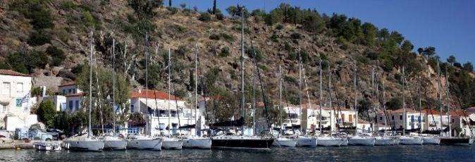 Greek Sails flotilla & bareboat charter yachts along the quay at their Poros yacht base