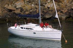 A Sun Odyssey 32 sailing yacht at anchor