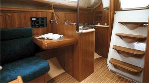 The main saloon and companionway of a Sun Odyssey 32 sailing yacht