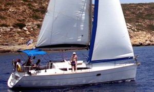 A Greek Sails Sun Odyssey 32 sailing yacht underway during a flotilla sailing holiday