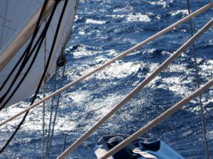 The sun glistens off the surface of the crystal clear Aegean during a Greek Sails flotilla sailing holiday