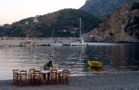 Real waterside eating in Sabatiki as tables are laid out on the beach at the end of the day
